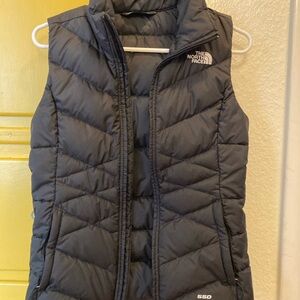 Black North Face puffy vest.